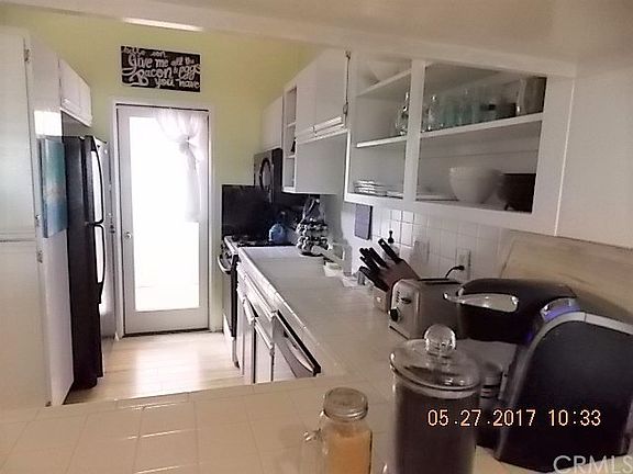 kitchen has breakfast bar and indoor access to garage.