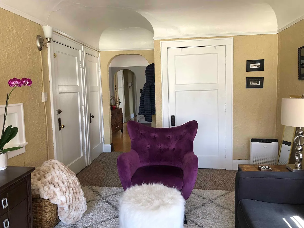 living room entrance door on left with from hall closet. walk-in closet ahead - 2402 S Lenox St #4