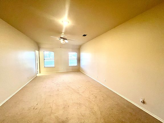 Huge master bedroom with attached master bath & closet. (Lighting not great in pic)