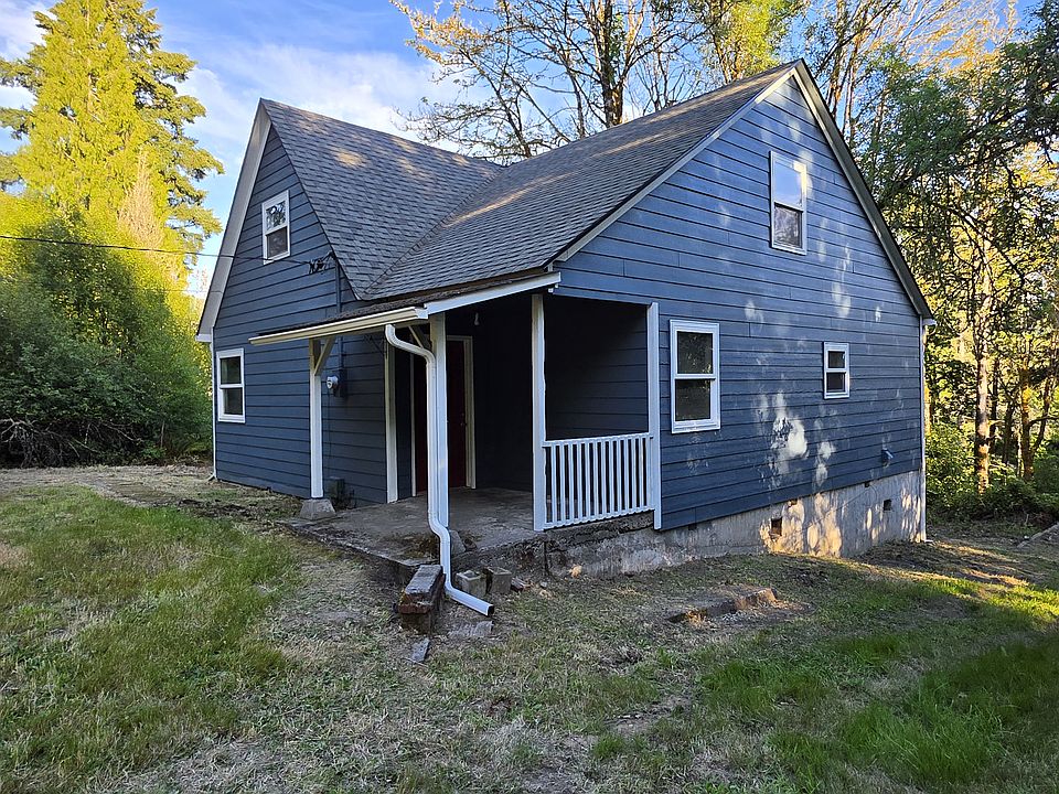 Front west side of house from driveway with covered entry