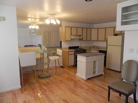 KITCHEN AND DINING AREA WITH CENTER ISLAND