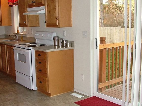 Sliding double doors lead to lg. deck & back yard