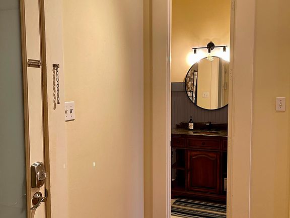 Guest bathroom with new antique vanity, paint and light fixtures.