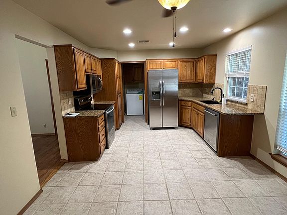 Kitchen, pantry, updated appliances, washer & dryer included. Extra space for breakfast nook, granite counter tops and matching center island (not pictured) included for extra storage and counter space.