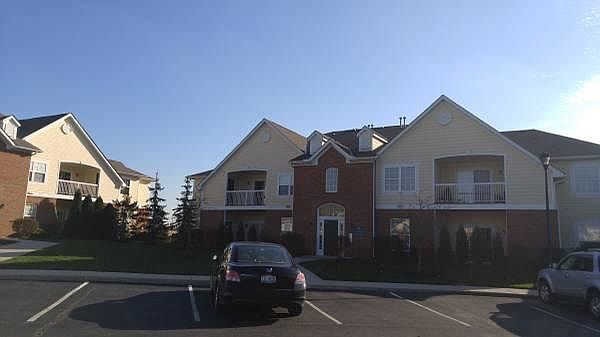 Front view of building unit located on ground floor with secured entrance.