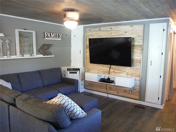 Large, open living room with custom wood accents