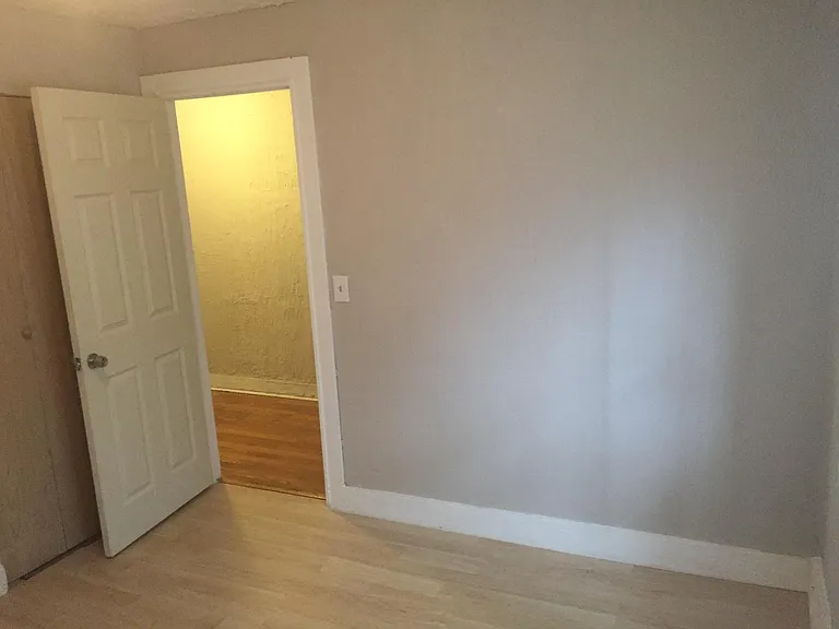 1st bedroom near the entrance with windows to street