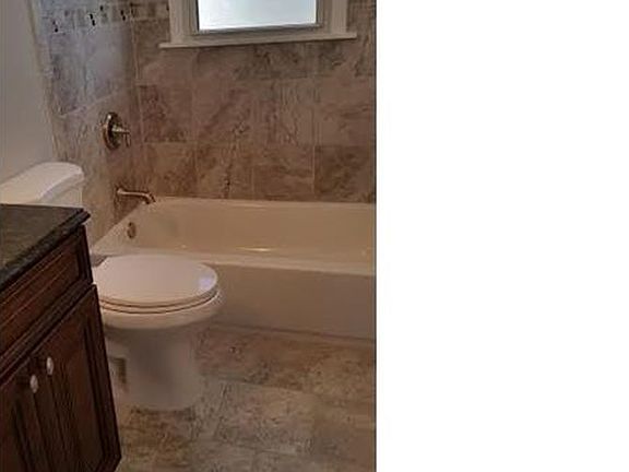 Gorgeous new bath with tile surround and all new fixtures!
