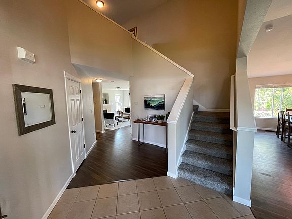 view from entry. Living room on the left, dining on the right