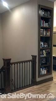 Columns & Bookshelf
						:
						bookshelf, columns on stairs going to the basement