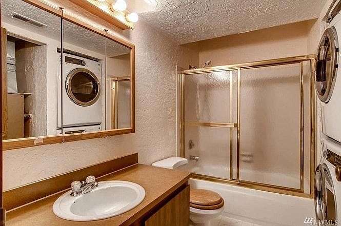 bathroom with washer and dryer