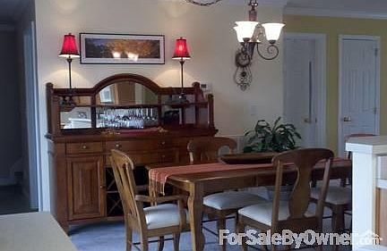 Inviting dining room opens to back porch
						:
						Lovely dining area that opens onto back porch through sliding glass doors.