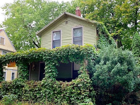 Ivy covered front porch on quiet one way street. Fenced backyard has deck.