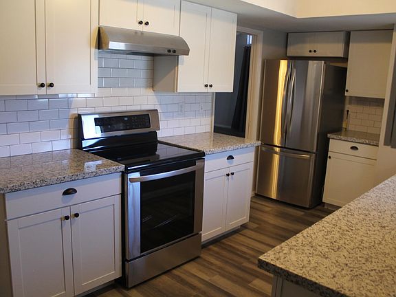 Brand new electric stove and french door fridge.