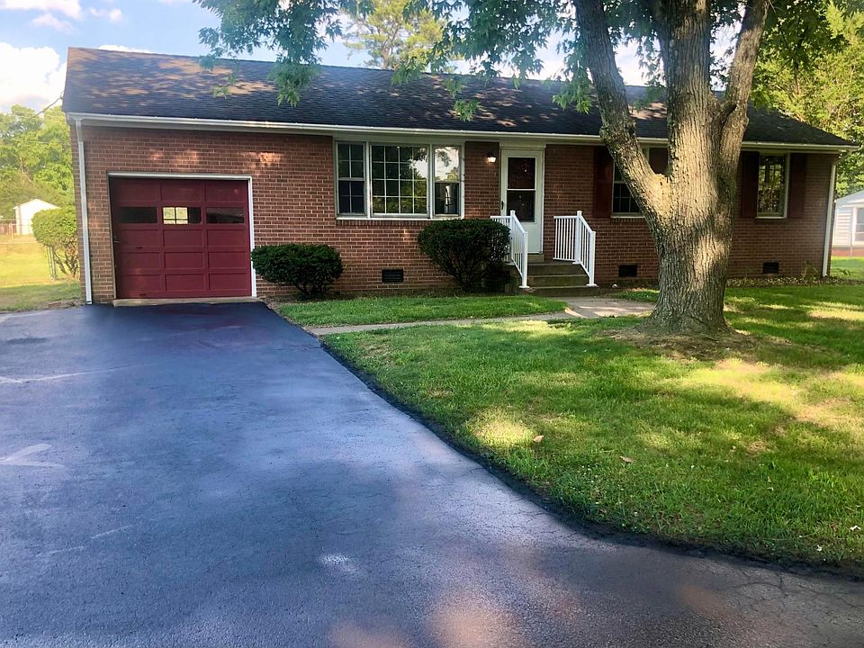Beautiful one-story brick rancher with ATTACHED garage and paved driveway