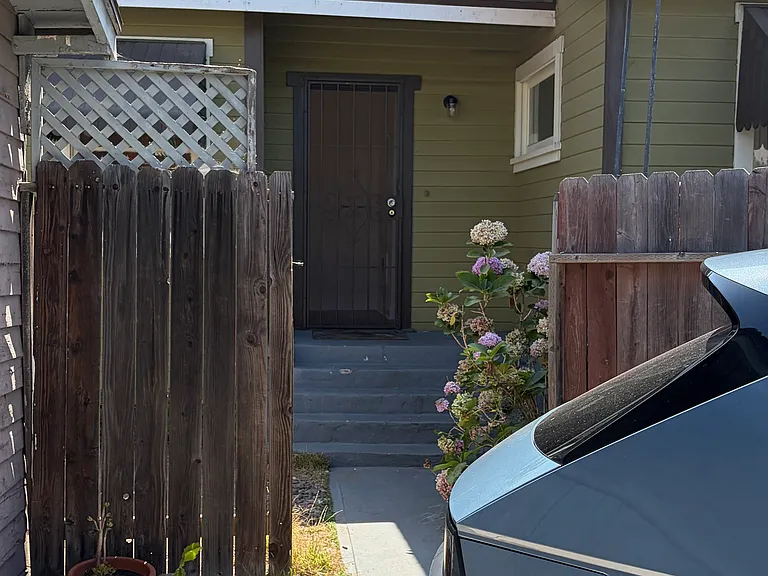 Home entry w private parking area in front.