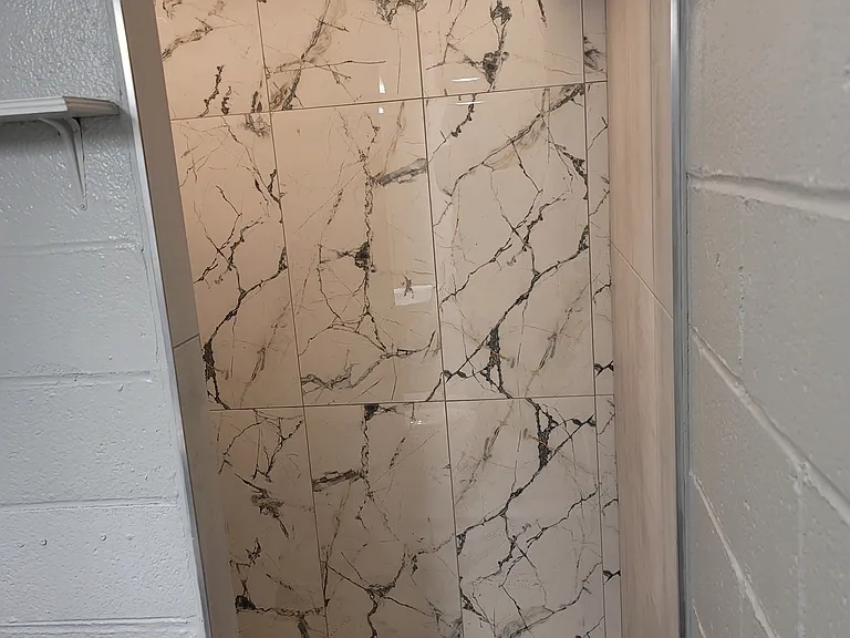Marble tile shower, lit (2nd bathroom)