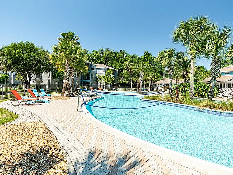 Cabana Beach Gainesville-Off Campus Apartments Near University of Florida-Resort Style Waterfall Pool with Volleyball