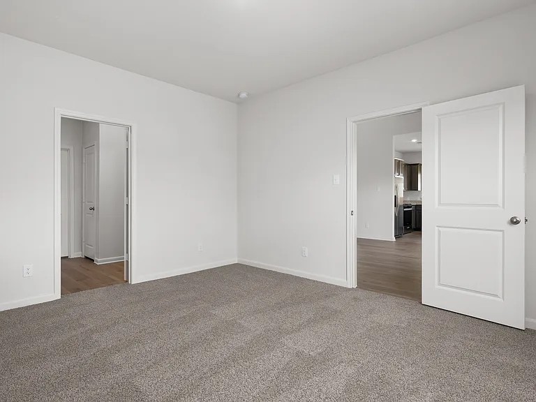 The master suite has a large bedroom, ensuite bathroom and a large walk-in closet.