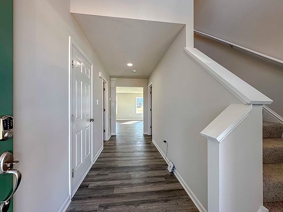 Foyer entry with turned staircase