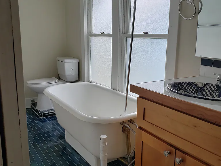 Restored clawfoot tub with Pratt and Larson tile throughout!