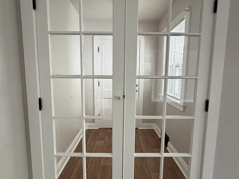 Mudroom from the living room with double doors closed