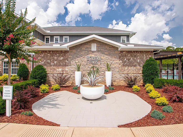 Immerse yourself in the sophisticated exterior of the Rowan Park Clubhouse, enveloped by newly landscaped grounds and enhanced amenities, creating the perfect backdrop for your dream home in Little Rock.