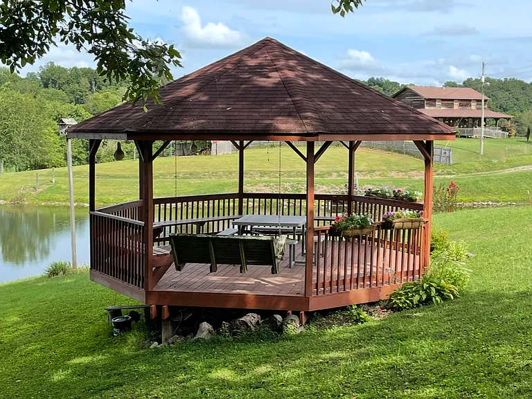 Large gazebo with table for eight and a swing