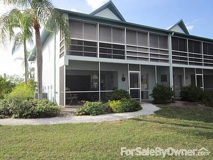 Front view of Condo and screened lanai
						:
						View from the waters edge,approximately 50 feet away