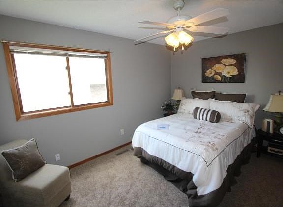 Very nice size master bedroom with lots of light and ceiling fan and new carpet.
