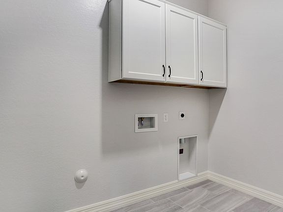 Laundry room with cabinet space