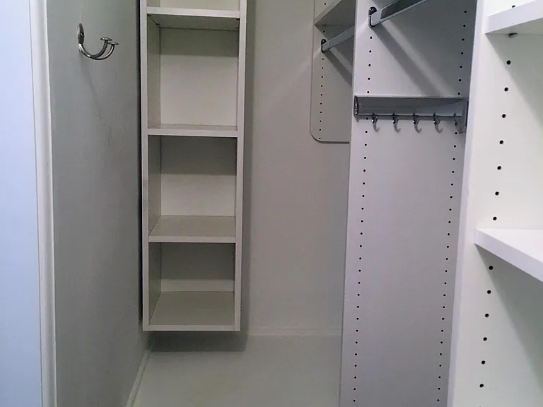 Primary bedroom walk-in closet
