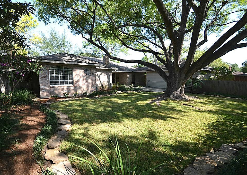 Enjoy another view of the back of this home from the fully fenced backyard.