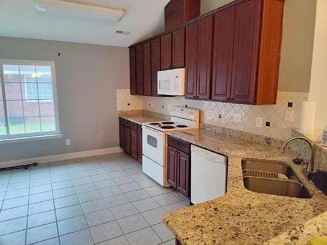 Open Kitchen with Granite Countertops