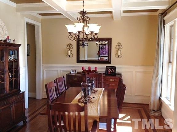 Coffered ceiling & wainscot - cherry wood inlay details in hardwood floors.