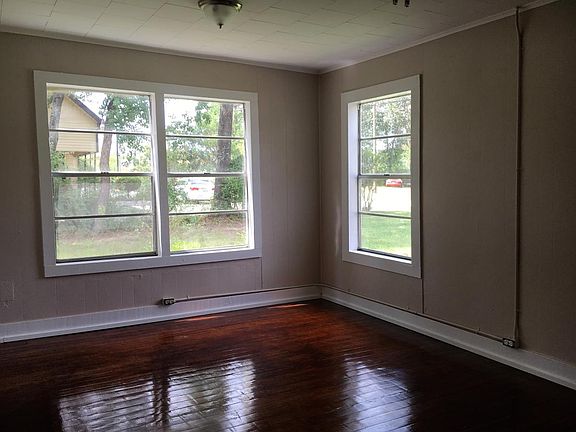 Living Room, lots of natural light, blinds on all windows.