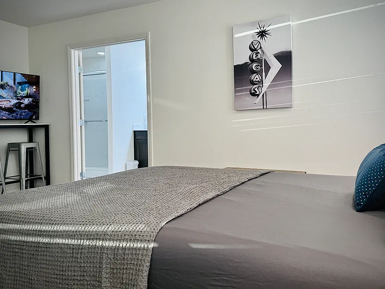 14x14 master suite w/ large smart TV. Also attached to master bathroom and walk-in closet.