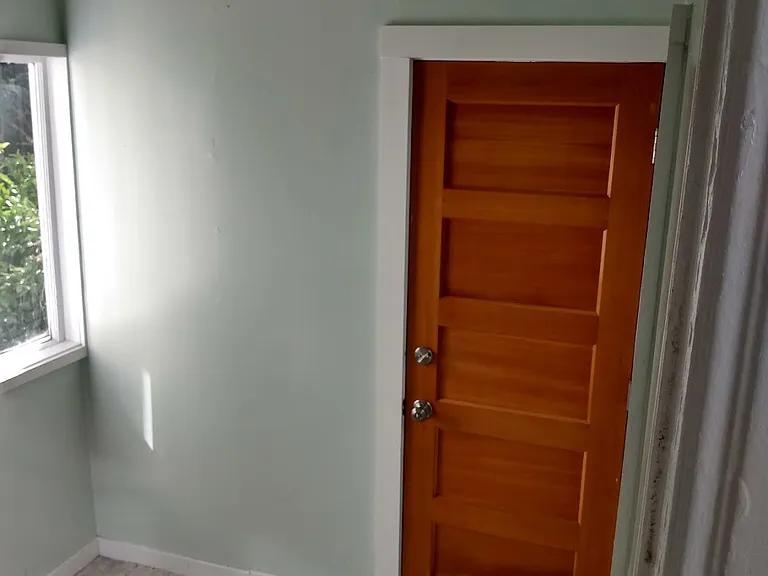 Back storage space with water heater (not shown) - door to back stairwell with access to coin operated laundry for building