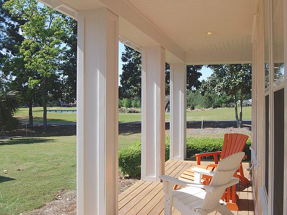 Wrap around covered porch with golf course views