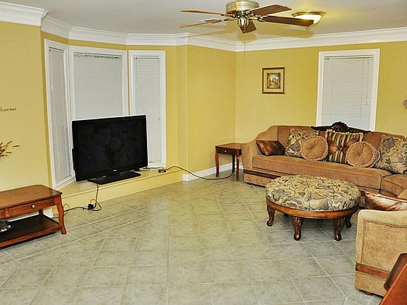 Comfy living room with tile flooring 13'x20'