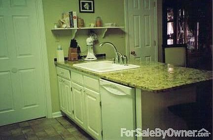 Family Room Fireplace
						:
						Unique raised wood burning fireplace with wood storage below. Textured chase.