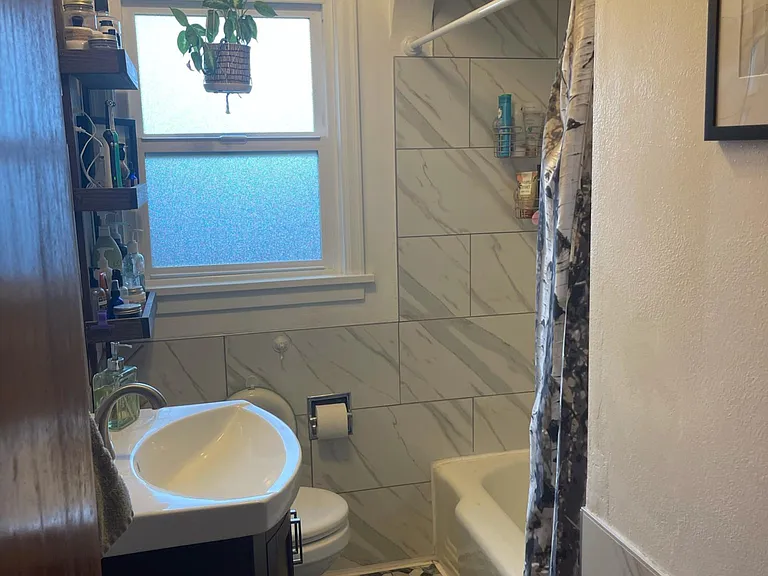 Newly-enameled tub. Plumbing updated for clean-tasting tap water, fast draining, and fast hot water.