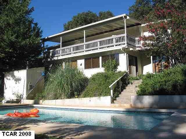 Pool, deck, house