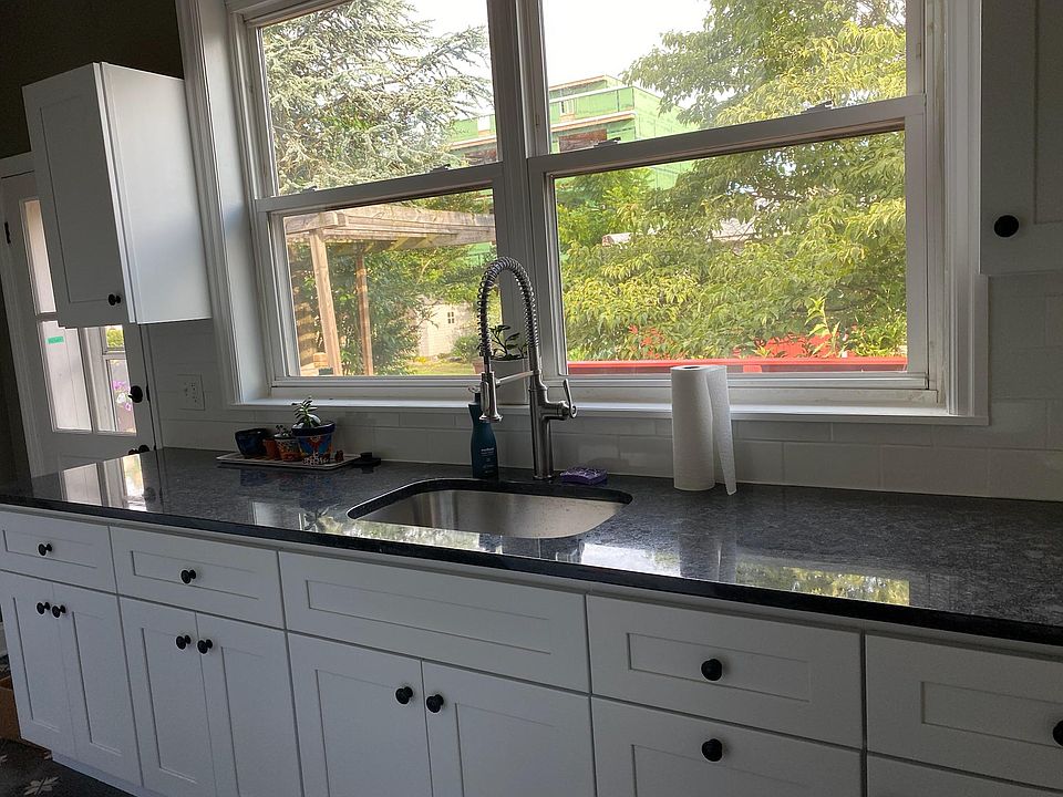Newly renovated kitchen with a great view from the sink to the backyard and deck. Granite countertops.