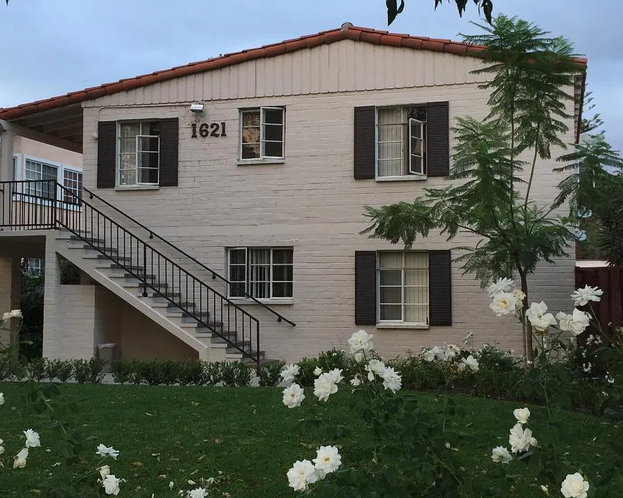FRONT OF BRICK 1940s BUILDING - 8 UNITS