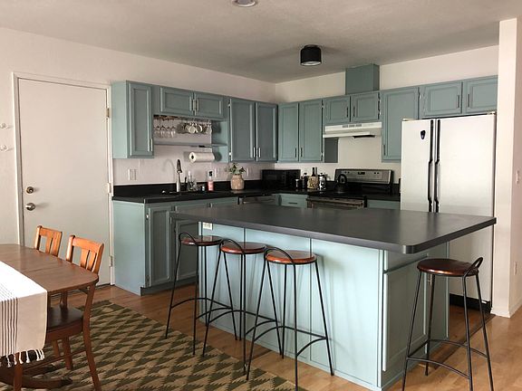 Recently updated kitchen will inspire great conversation around the bar and ambitious cooking and baking projects. Dynamic lighting options, extensive counter and storage space, and a powerful induction range/convection oven can set the tone for processin