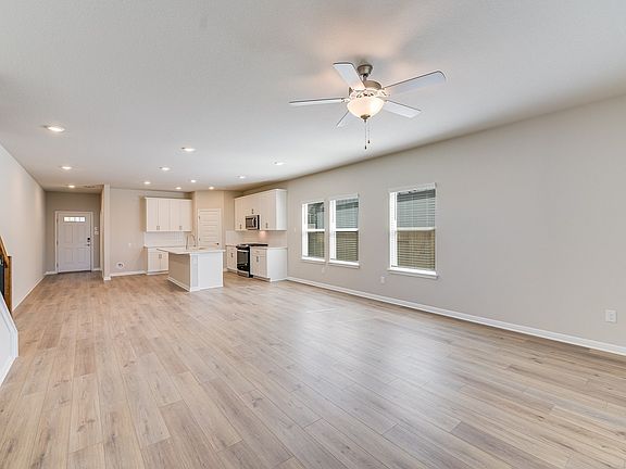 The Pearl s open concept living, kitchen, and dining areas are perfect for entertaining.