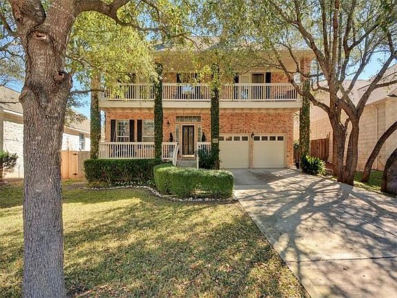 2 car garage with a nice long driveway.  Huge beautiful trees fill the yard