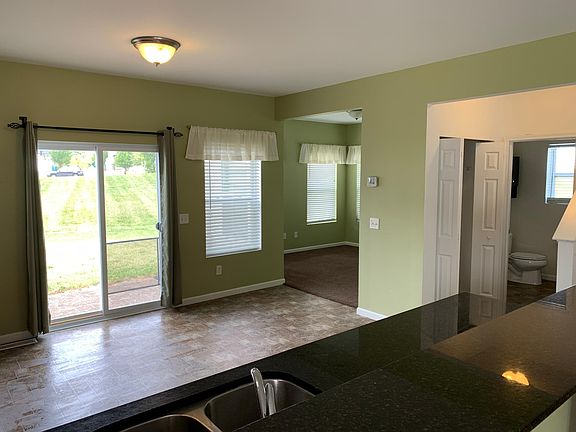 Kitchen with flex room in background.