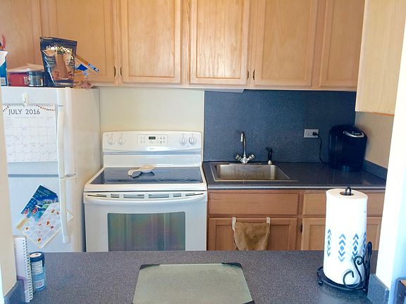 GALLEY KITCHEN WITH REFRIGERATOR, OVEN, MICROWAVE AND LOADS